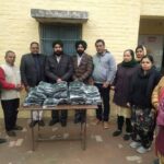 सांई मानव सेवा मिशन की तरफ से जरूरतमंद लोगों को बूट व स्वेटर वितरित किये